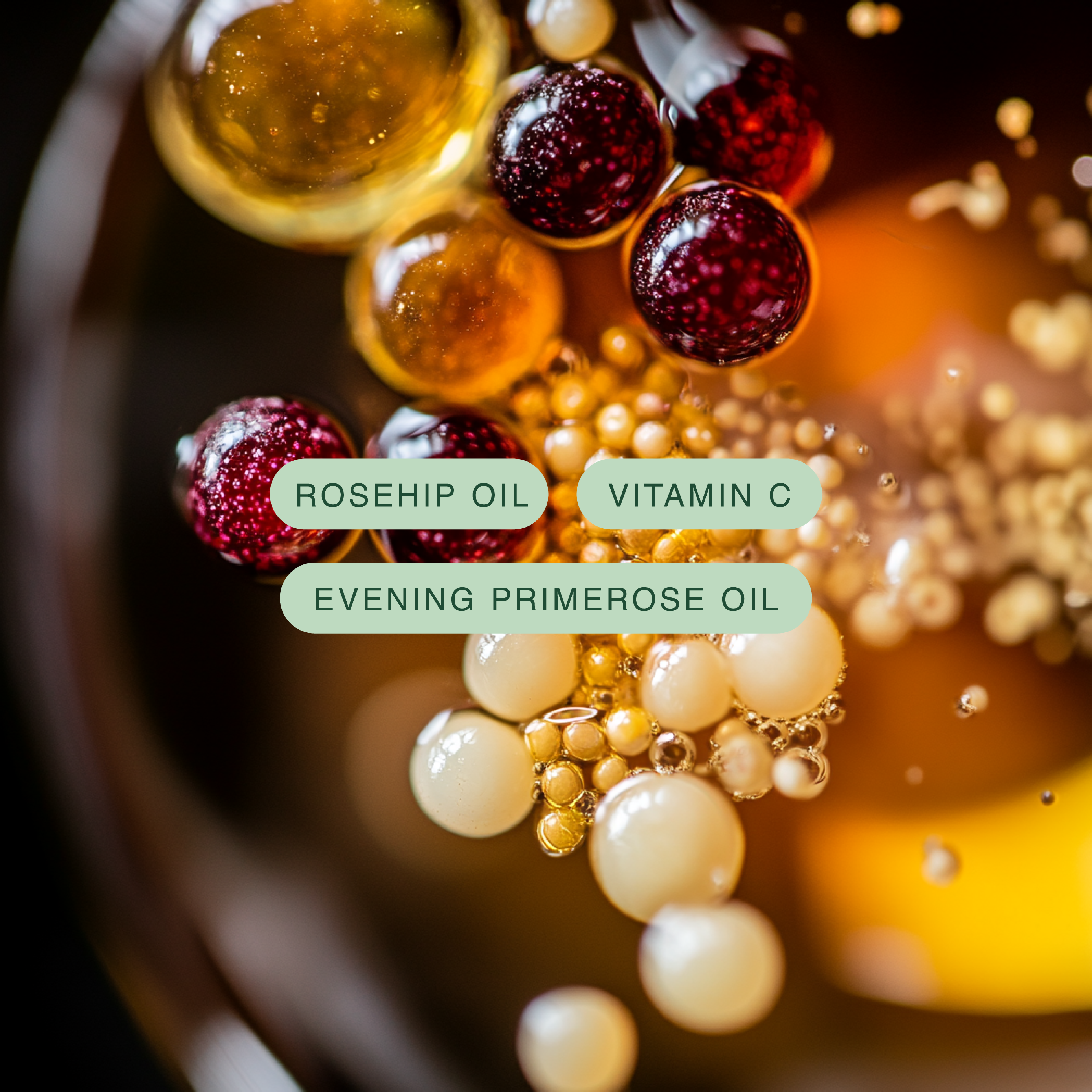 Close-up of rosehip oil, vitamin C, and evening primerose oil droplets with a dark background.