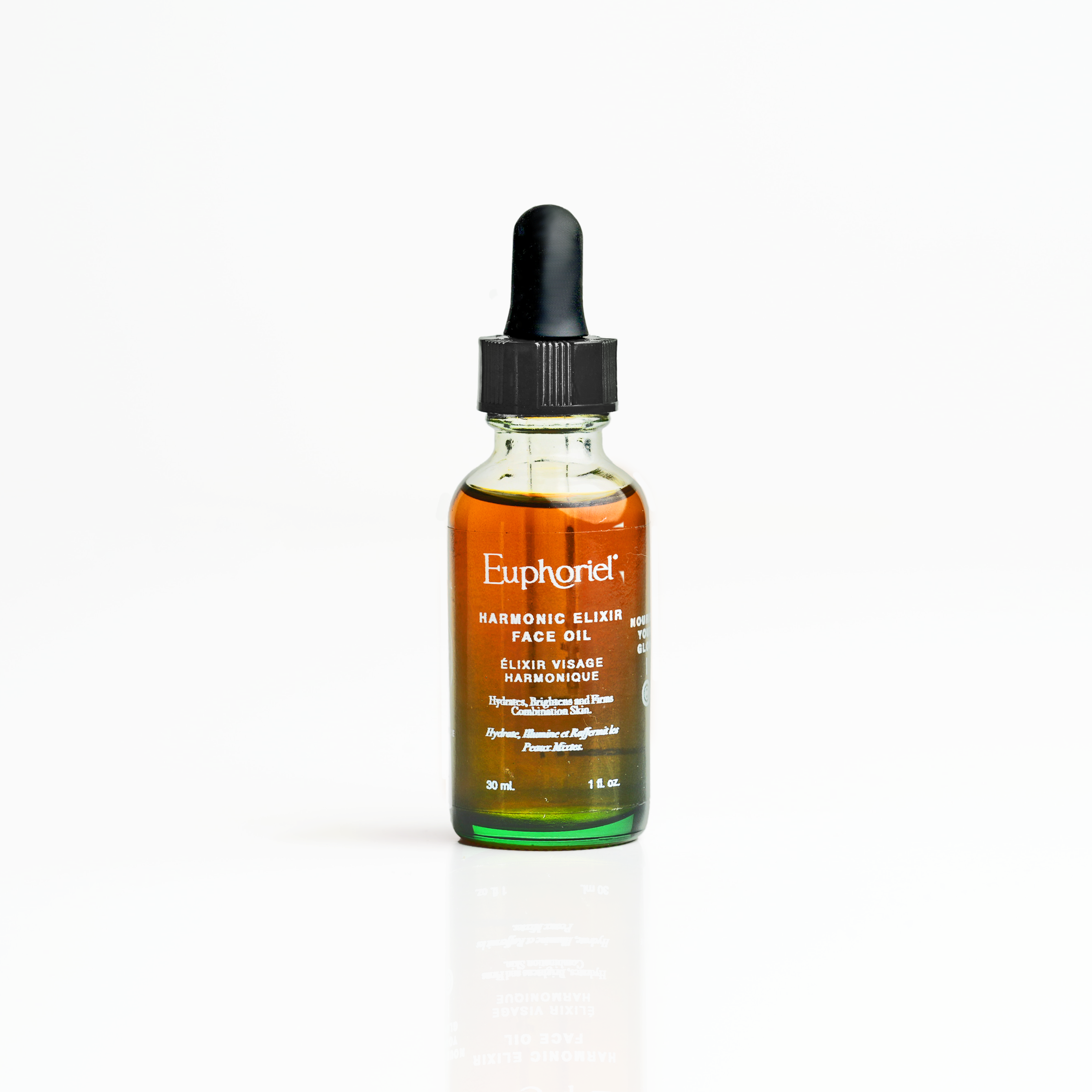 A bottle of Harmonic Elixir Face Oil with a dropper, labeled with the brand Euphoriel Beauty.