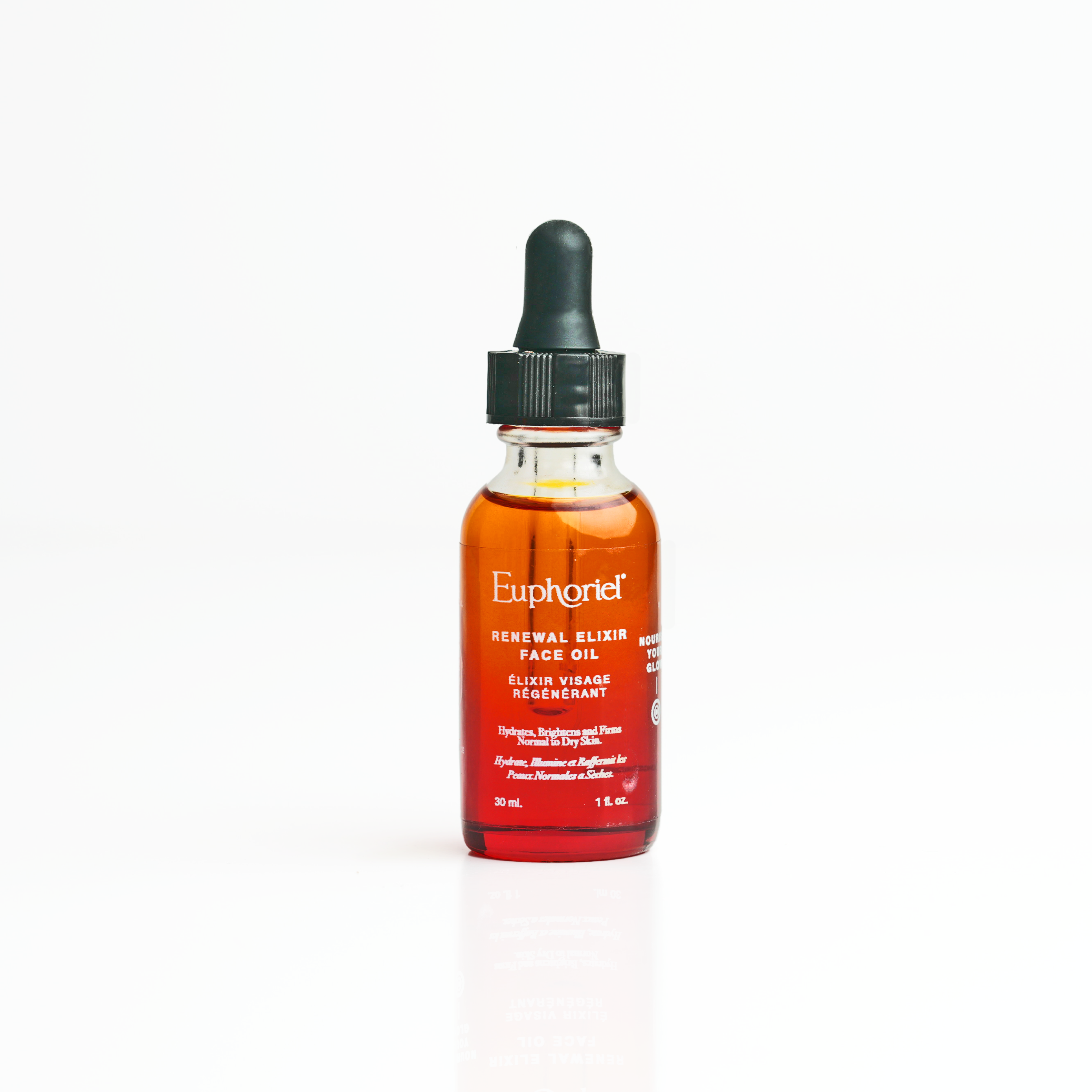 A glass bottle with a dropper containing the Renewal Elixir Face Oil by Euphorie, isolated on a white background.